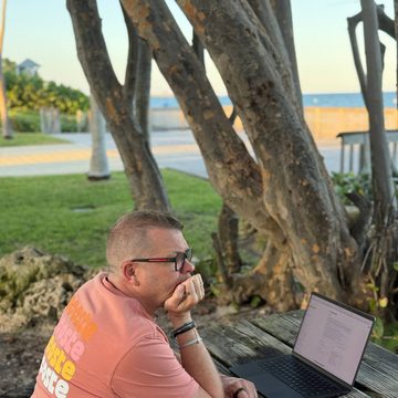 Serge Bulaev working outdoors by the ocean